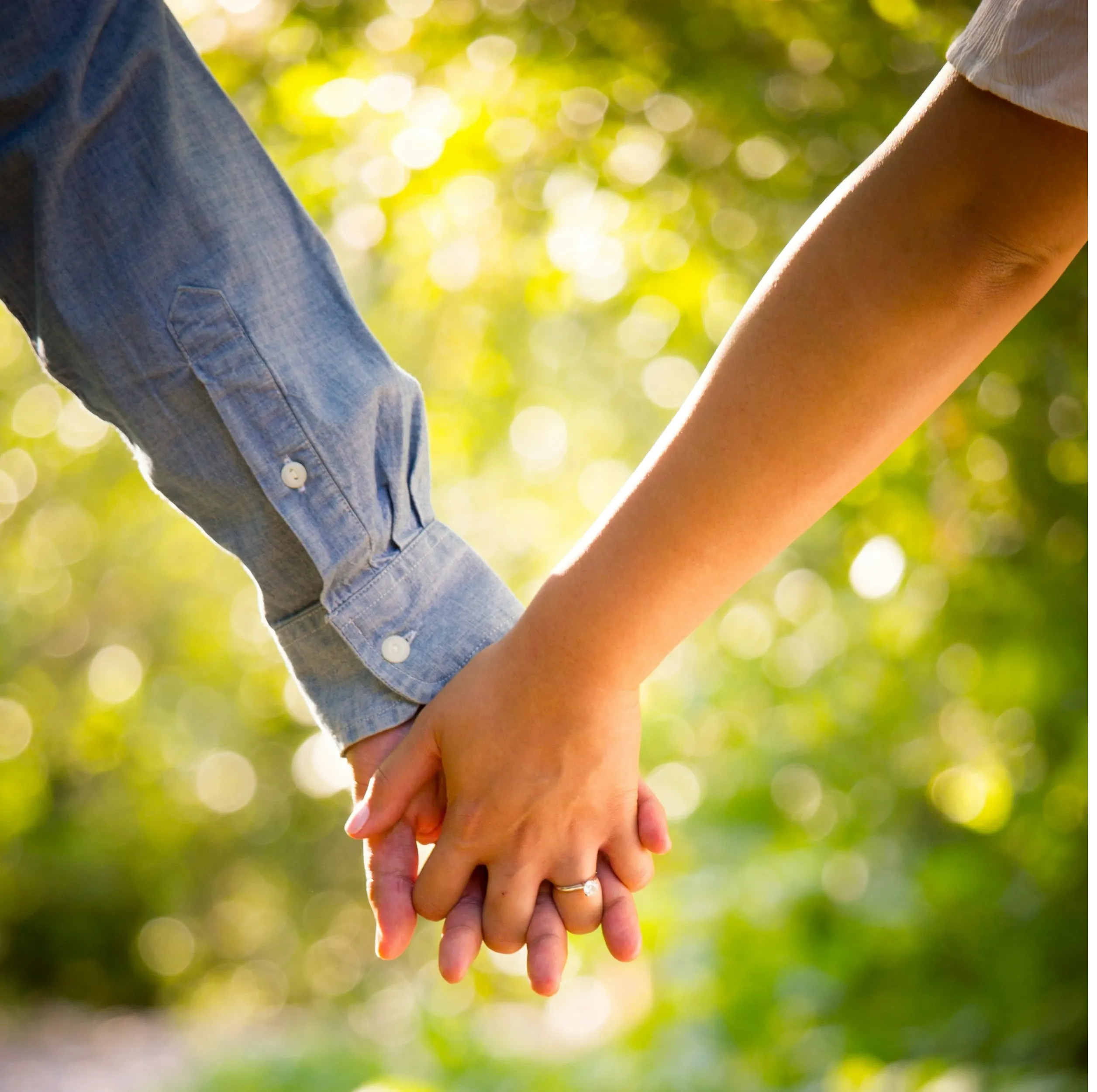 An image showing a couple holding hands, symbolizing connection and trust.